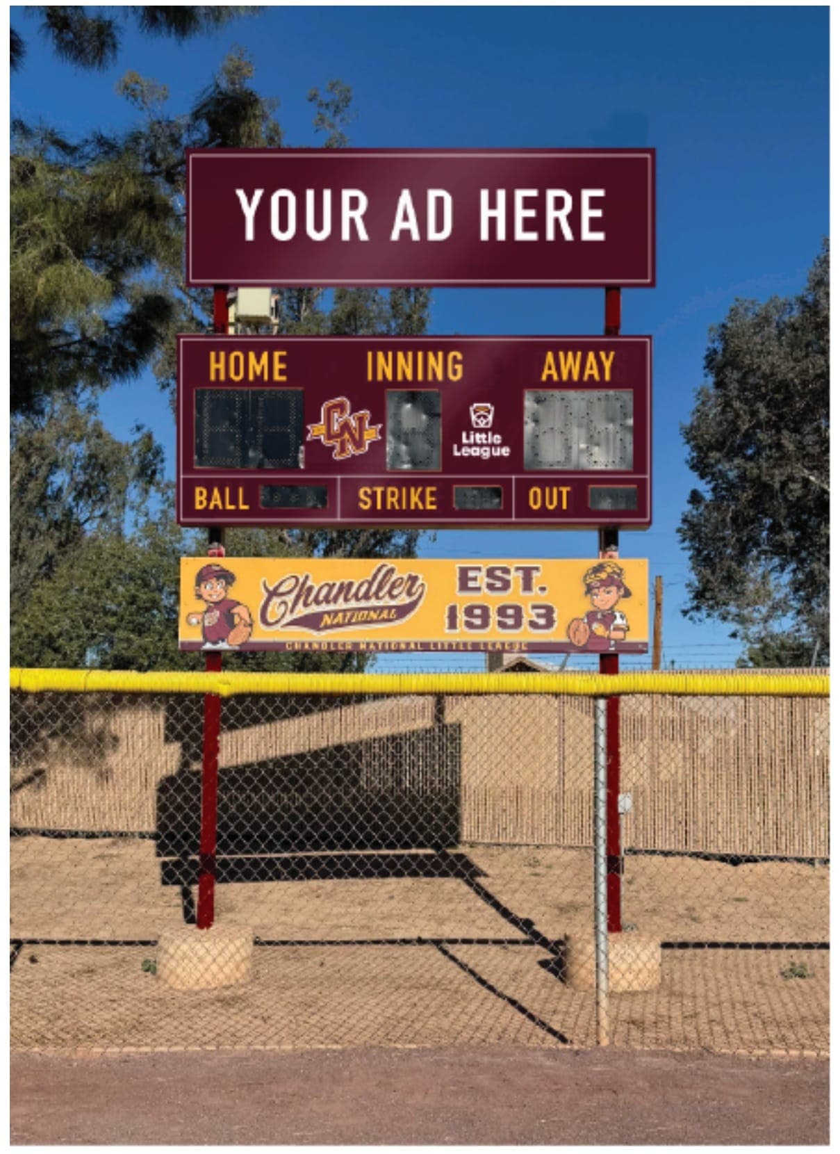 The maroon and gold Chandler National scoreboard at Snedigar Field 7, with the EST. 1993 banner